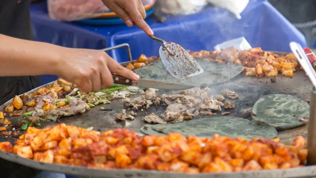 What percentage of Mexicans eat from street vendors at least once a week
